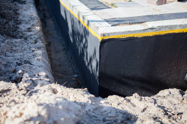 Professional Basement Waterproofing technician working in Powell, AL